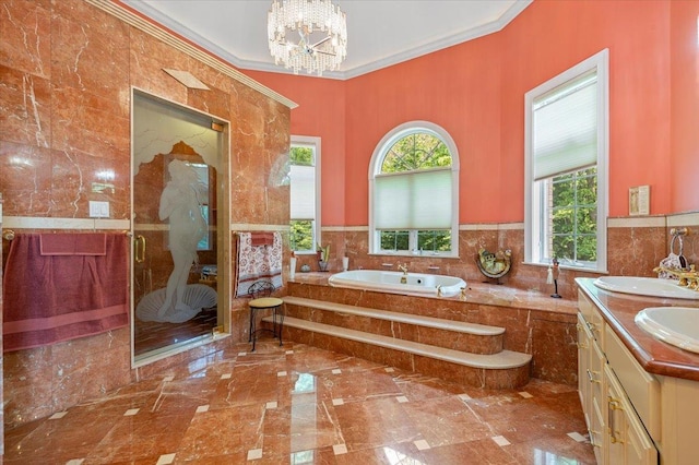 135 Millet St N, Dix Hills, NY 11746 - bathroom with marble tiled floors, a garden tub, tile walls, crown molding, and a wainscoted wall