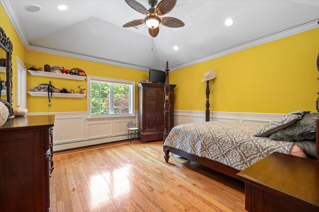 135 Millet St N, Dix Hills, NY 11746 - bedroom featuring a baseboard heating unit, wainscoting, ornamental molding, wood finished floors, and lofted ceiling
