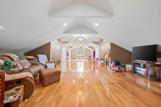 135 Millet St N, Dix Hills, NY 11746 - living room featuring vaulted ceiling and wood finished floors