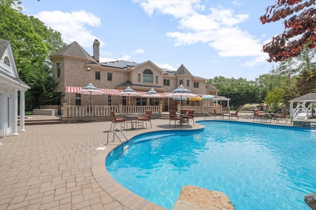 135 Millet St N, Dix Hills, NY 11746 - swimming pool with a gazebo, a patio, and outdoor dining space