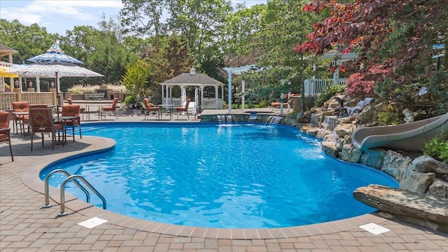 135 Millet St N, Dix Hills, NY 11746 - outdoor pool with a gazebo, a water slide, and a patio