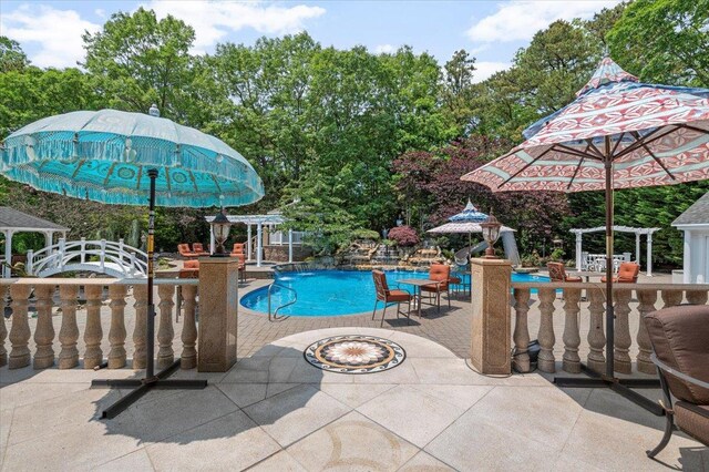 135 Millet St N, Dix Hills, NY 11746 - outdoor pool with a patio and view of wooded area