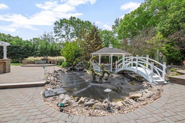 135 Millet St N, Dix Hills, NY 11746 - view of community with a gazebo, a patio, and view of wooded area