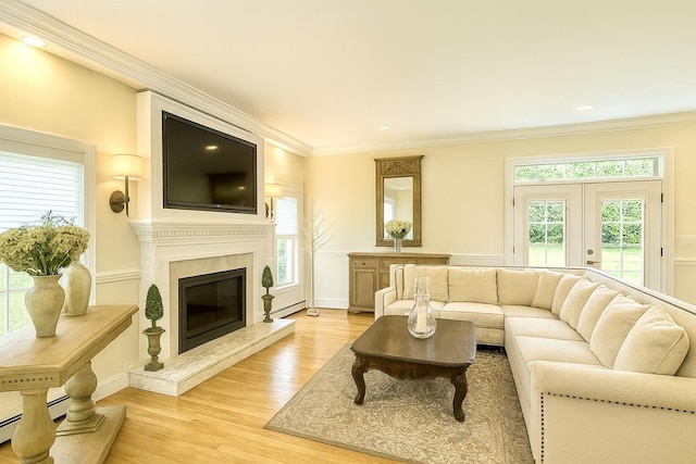 1 Ada Ln, East Setauket, NY 11733 - living room featuring light wood-style floors, crown molding, a fireplace, a baseboard radiator, and recessed lighting
