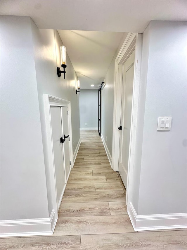 1 Ada Ln, East Setauket, NY 11733 - hallway featuring light wood-style flooring and baseboards