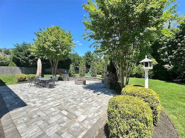 1 Ada Ln, East Setauket, NY 11733 - view of patio / terrace with outdoor dining space and a fire pit