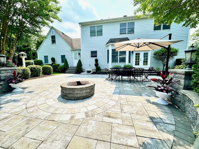 1 Ada Ln, East Setauket, NY 11733 - back of house featuring french doors, a patio area, and an outdoor fire pit