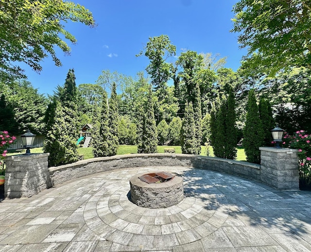 1 Ada Ln, East Setauket, NY 11733 - view of patio / terrace with an outdoor fire pit and a playground