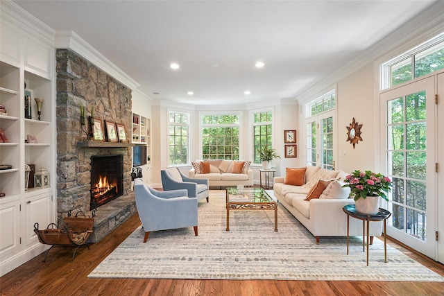 28 Stone Paddock Pl, Bedford, NY 10506 - living area with ornamental molding, a stone fireplace, dark wood-type flooring, and recessed lighting