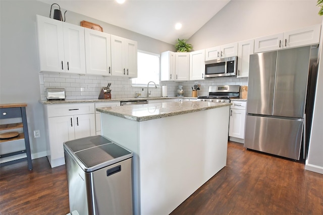 6 Zebra Rd, Rocky Point, NY 11778 - kitchen with stainless steel appliances, lofted ceiling, backsplash, dark wood finished floors, and a center island
