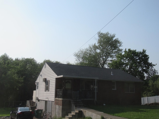 22 Booth Blvd, Wappingers Falls, NY 12590 - rear view of house with covered porch, a yard, and stairway
