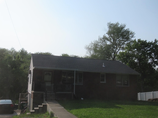 22 Booth Blvd, Wappingers Falls, NY 12590 - ranch-style house featuring covered porch, a front lawn, and brick siding
