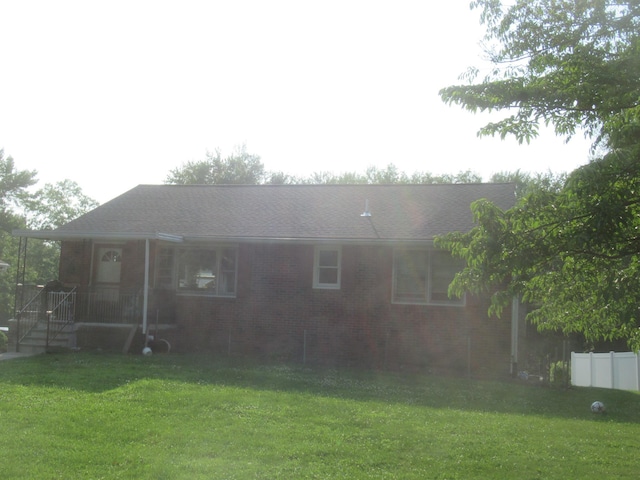 22 Booth Blvd, Wappingers Falls, NY 12590 - rear view of property with brick siding and a lawn