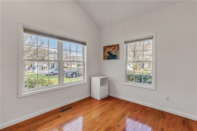 1200 Half Moon Bay Dr, Croton-On-Hudson, NY 10520 - empty room featuring light wood finished floors and vaulted ceiling