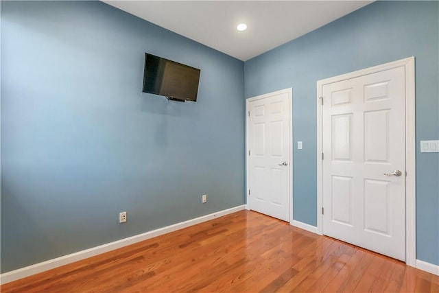 1200 Half Moon Bay Dr, Croton-On-Hudson, NY 10520 - unfurnished bedroom with light wood-style floors and recessed lighting