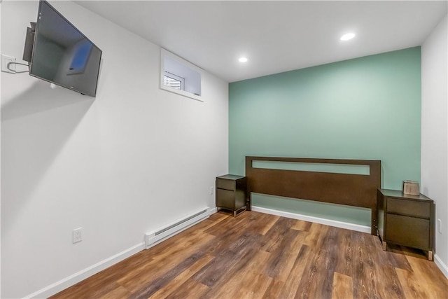 1200 Half Moon Bay Dr, Croton-On-Hudson, NY 10520 - finished below grade area with a baseboard heating unit, wood finished floors, and recessed lighting