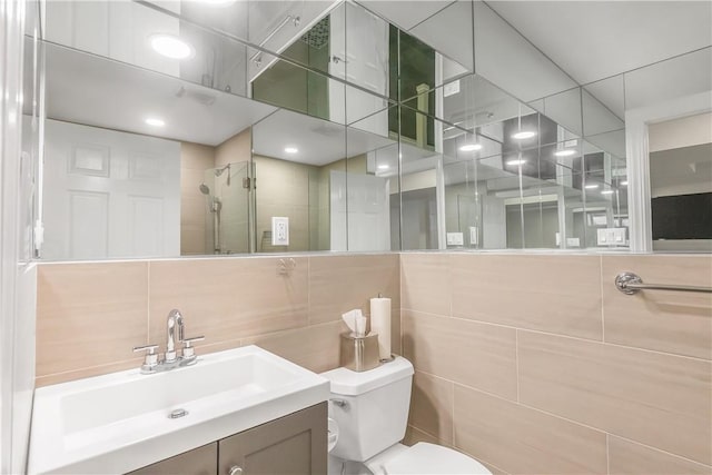 1200 Half Moon Bay Dr, Croton-On-Hudson, NY 10520 - bathroom featuring vanity, tiled shower, tile walls, and backsplash