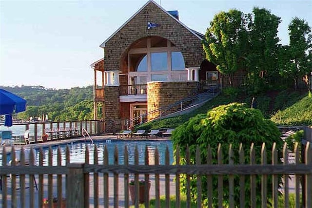 1200 Half Moon Bay Dr, Croton-On-Hudson, NY 10520 - rear view of house featuring a community pool