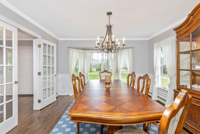 15 Hermitage St, Wading River, NY 11792 - dining area with a chandelier, plenty of natural light, dark wood-type flooring, and ornamental molding