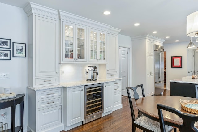 15 Hermitage St, Wading River, NY 11792 - indoor bar with wine cooler, stainless steel built in refrigerator, dark wood-style floors, recessed lighting, and backsplash