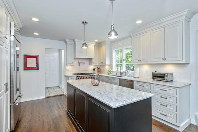15 Hermitage St, Wading River, NY 11792 - kitchen with appliances with stainless steel finishes, white cabinets, dark wood finished floors, tasteful backsplash, and recessed lighting