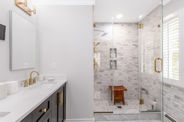 15 Hermitage St, Wading River, NY 11792 - bathroom featuring double vanity, a baseboard radiator, a shower stall, and recessed lighting