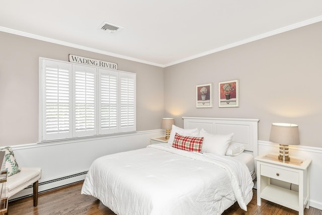 15 Hermitage St, Wading River, NY 11792 - bedroom featuring ornamental molding, baseboard heating, and wood finished floors