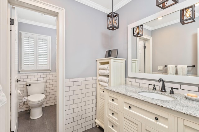 15 Hermitage St, Wading River, NY 11792 - bathroom featuring tile walls, vanity, ornamental molding, and wainscoting