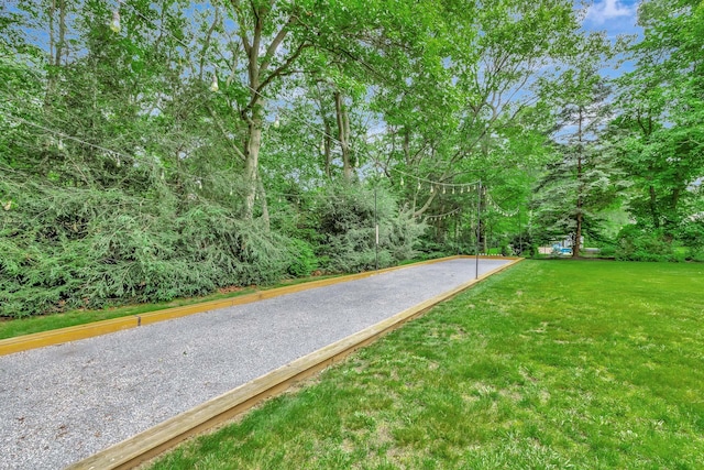 15 Hermitage St, Wading River, NY 11792 - view of home's community with a game area and a lawn