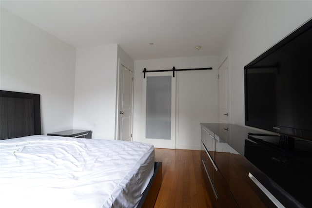132-35 41st Rd Unit 5D, Flushing, NY 11355 - bedroom with dark wood-style floors and a barn door