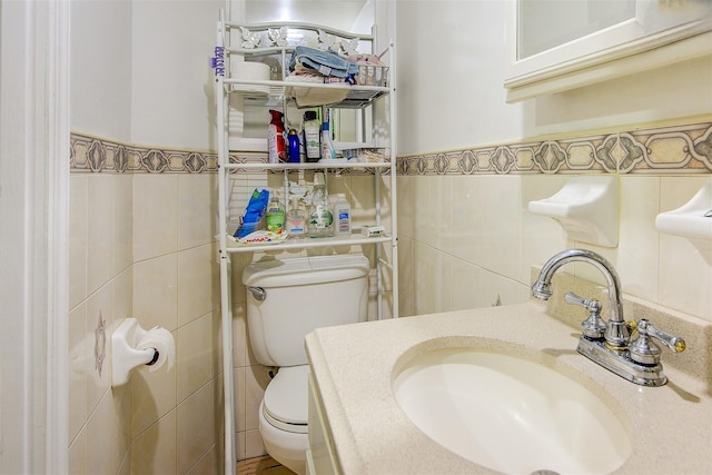 56-20 68th St, Maspeth, NY 11378 - bathroom featuring tile walls, a wainscoted wall, and vanity