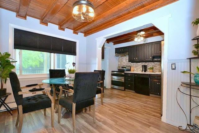 70 Islip Ave, Islip, NY 11751 - dining area featuring a wooden ceiling with exposed beams, light wood-style floors, and a chandelier