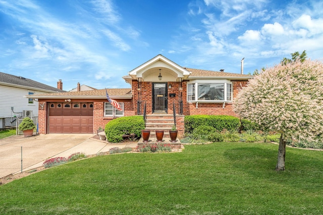 3324 Murdock Ave, Oceanside, NY 11572 - view of front of property with brick siding, driveway, a garage, and a front yard