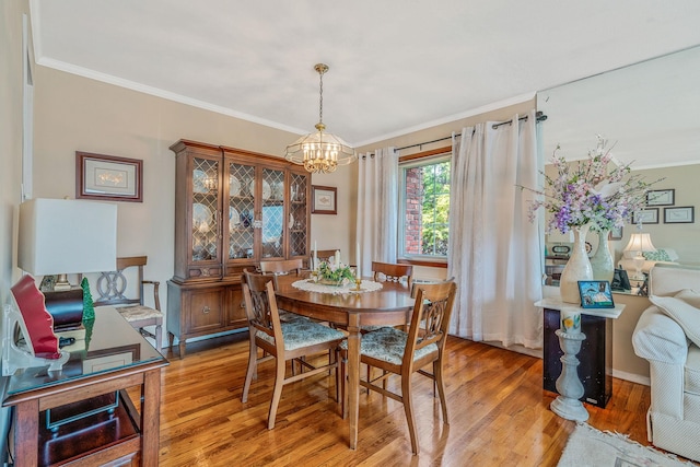 3324 Murdock Ave, Oceanside, NY 11572 - dining space with a chandelier, light wood-type flooring, and ornamental molding