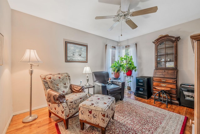 3324 Murdock Ave, Oceanside, NY 11572 - living area with wood finished floors and ceiling fan