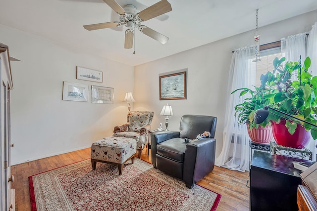 3324 Murdock Ave, Oceanside, NY 11572 - living area with a ceiling fan and wood finished floors