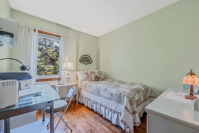 3324 Murdock Ave, Oceanside, NY 11572 - bedroom featuring wood finished floors and a desk