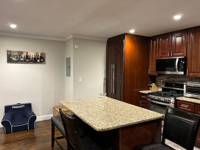 159-02 Cross Island Pkwy Unit 6-22, Whitestone, NY 11357 - kitchen with stainless steel appliances, ornamental molding, a center island, dark wood-style flooring, and light stone counters