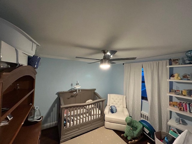 159-02 Cross Island Pkwy Unit 6-22, Whitestone, NY 11357 - bedroom with a crib, ceiling fan, and crown molding