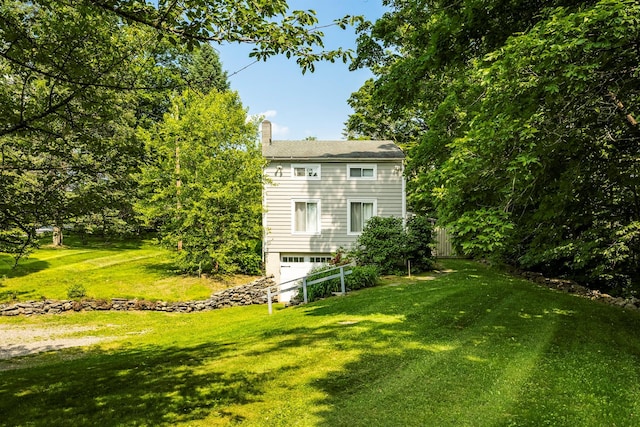 252 Ernest Rd, Millbrook, NY 12545 - view of grassy yard featuring an attached garage