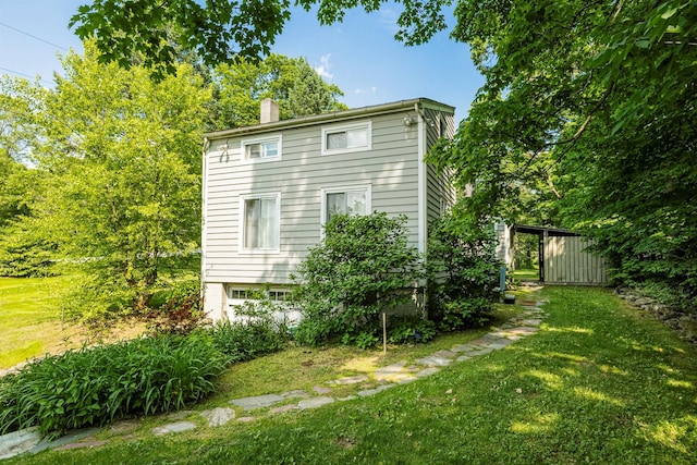 252 Ernest Rd, Millbrook, NY 12545 - view of home's exterior with a lawn and a chimney
