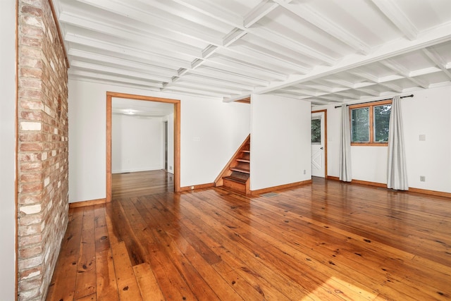 252 Ernest Rd, Millbrook, NY 12545 - empty room featuring stairs, hardwood / wood-style floors, and coffered ceiling