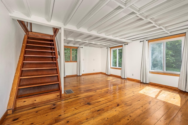 252 Ernest Rd, Millbrook, NY 12545 - spare room with wood-type flooring, stairway, and beamed ceiling
