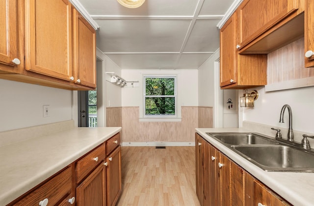 252 Ernest Rd, Millbrook, NY 12545 - kitchen with light wood-style floors, brown cabinetry, and light countertops