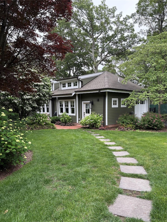 120 Cambon Ave, Saint James, NY 11780 - view of front of property with a front lawn and roof with shingles