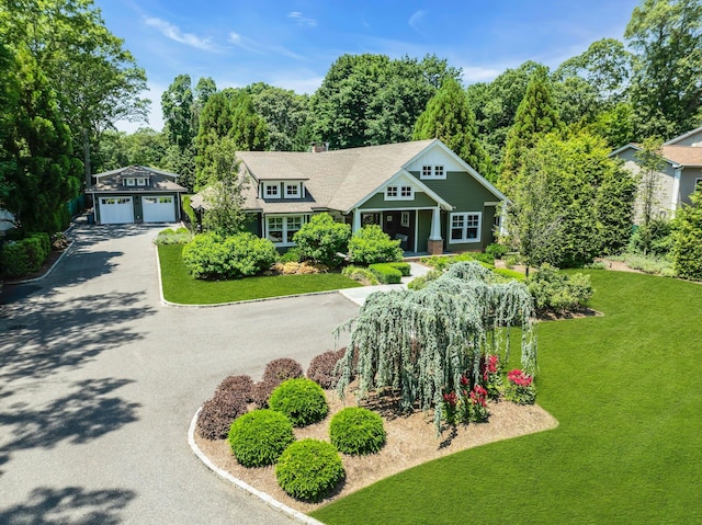 120 Cambon Ave, Saint James, NY 11780 - shingle-style home featuring asphalt driveway, an outbuilding, a front yard, and a chimney