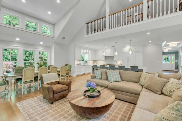 120 Cambon Ave, Saint James, NY 11780 - living area featuring a high ceiling, recessed lighting, and light wood-style flooring