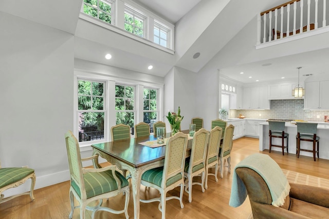 120 Cambon Ave, Saint James, NY 11780 - dining space with a towering ceiling and light wood-style floors