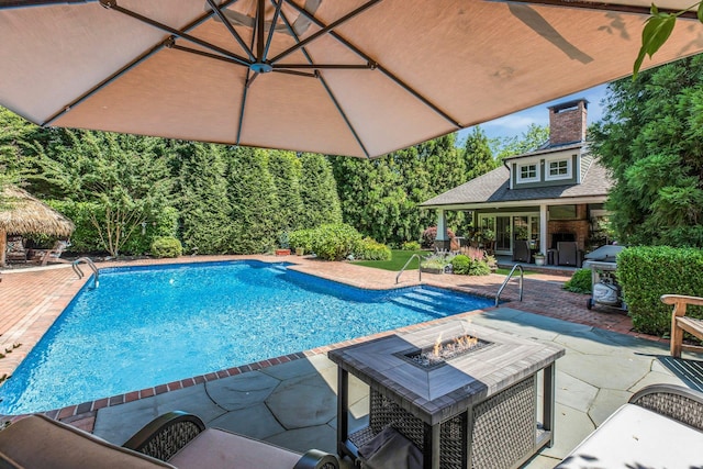 120 Cambon Ave, Saint James, NY 11780 - outdoor pool with a patio, an outdoor fire pit, area for grilling, and a storage structure