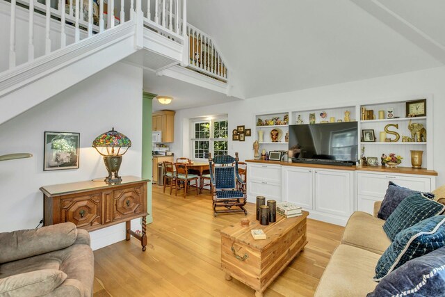 120 Cambon Ave, Saint James, NY 11780 - living area with light wood finished floors and high vaulted ceiling